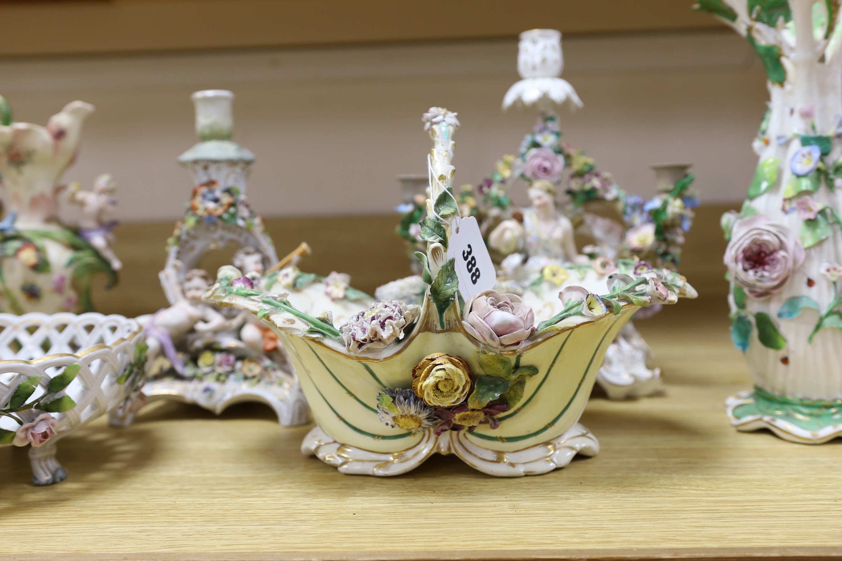 A group of 19th century and later continental floral encrusted porcelain items